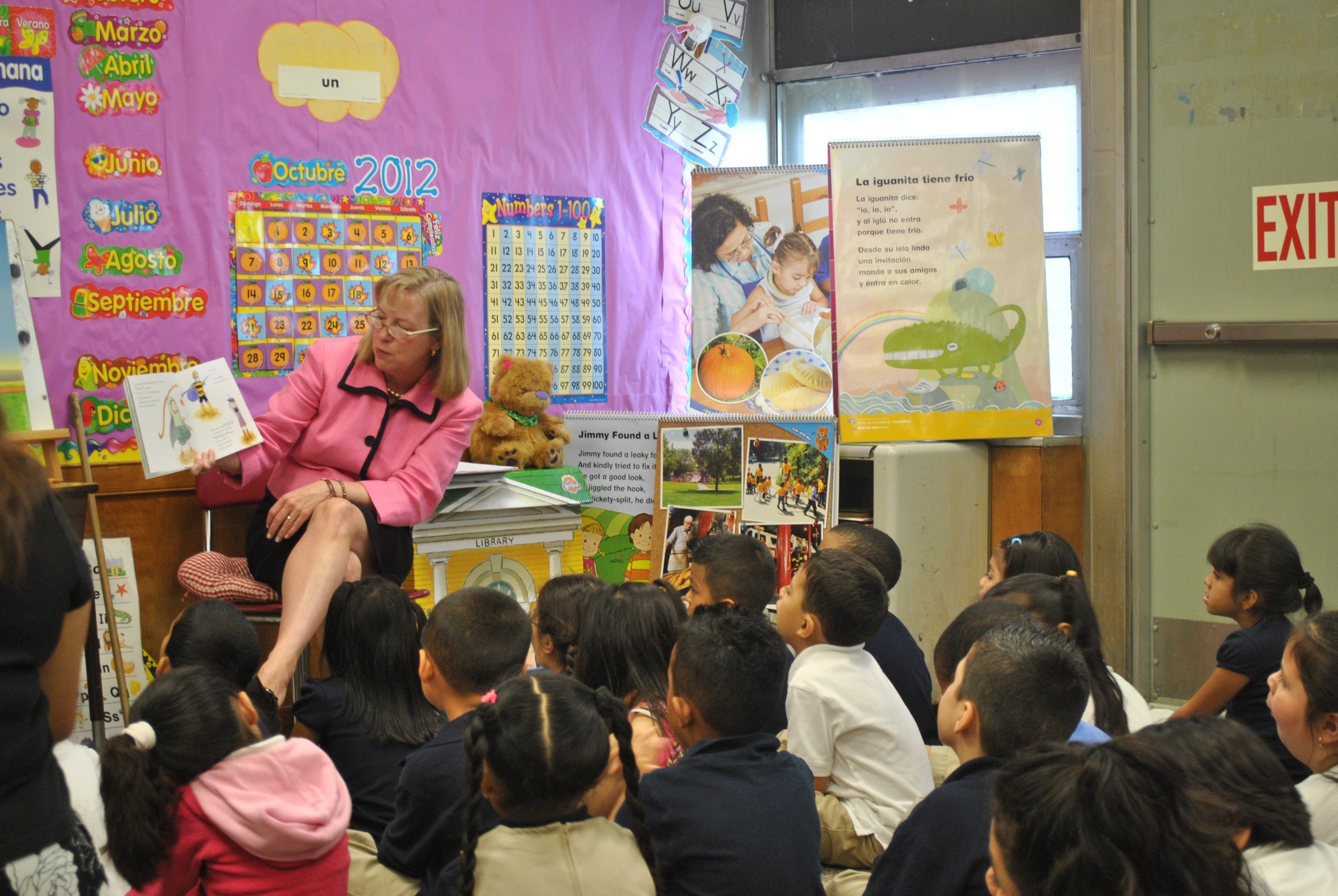 Elizabeth Burke Bryant, executive director of Rhode Island KIDS COUNT, reading to to a class at the William D'Abate Elementary School in Providence. As a result of the federal sequester, Rhode Island is losing almost 400 seats in Head Start this year.