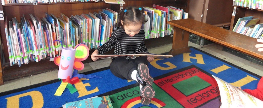 A child who is a participant in the Ready To Learn Providence, or R2LP program, a program of the Providence Plan, as shown on a post on the R2LP's website.
