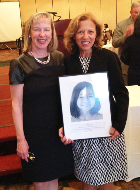 Elizabeth Burke Bryant, left, and Senate President Teresa Paiva Weed pose with this year's Covering Kids award.