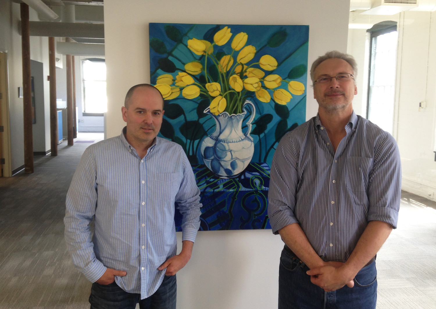 Clifford Grimm, left, and William Martin, of EpiVax, at the new office location in Olneyville.