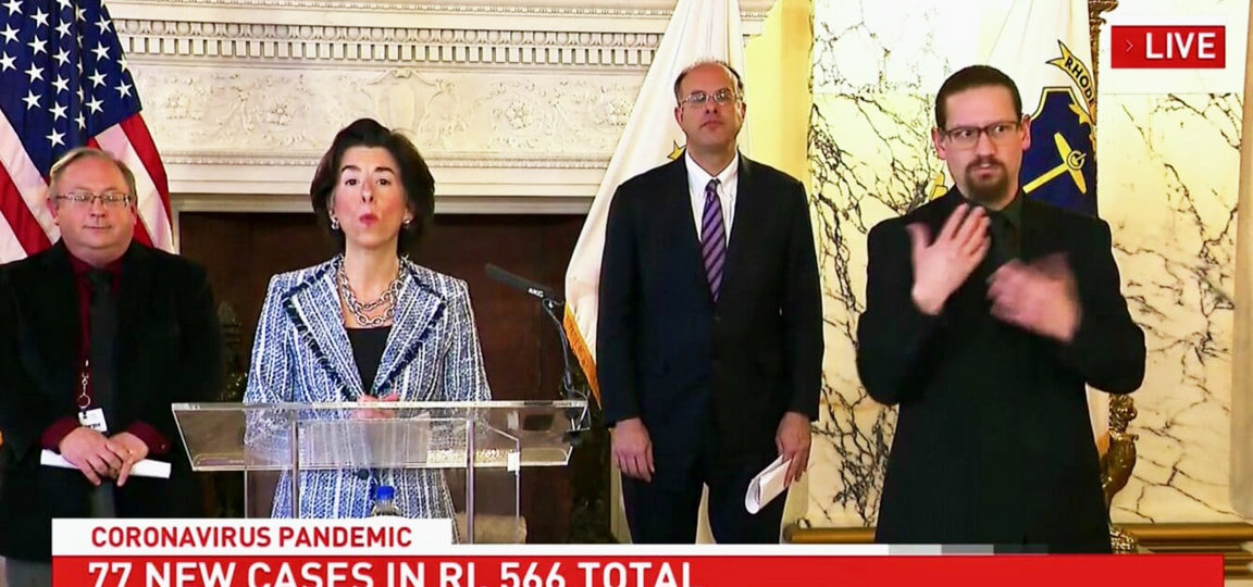 A daily news briefing by Gov. Gina Raimondo. From left, Dr. James McDonald, R.I. Department of Health; the Governor; Commerce Corp. Secretary Stefan Pryor; and the sign language interpreter.