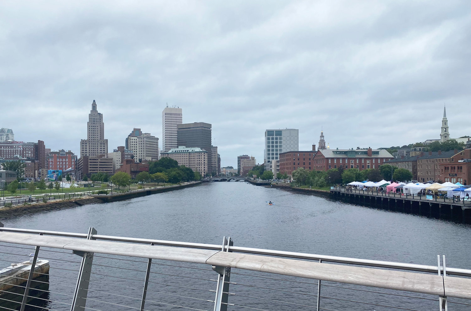 The forecast from the pedestrian bridge in Providence: rising waters threaten the river walk through downtown Providence, a consequence of climate change.